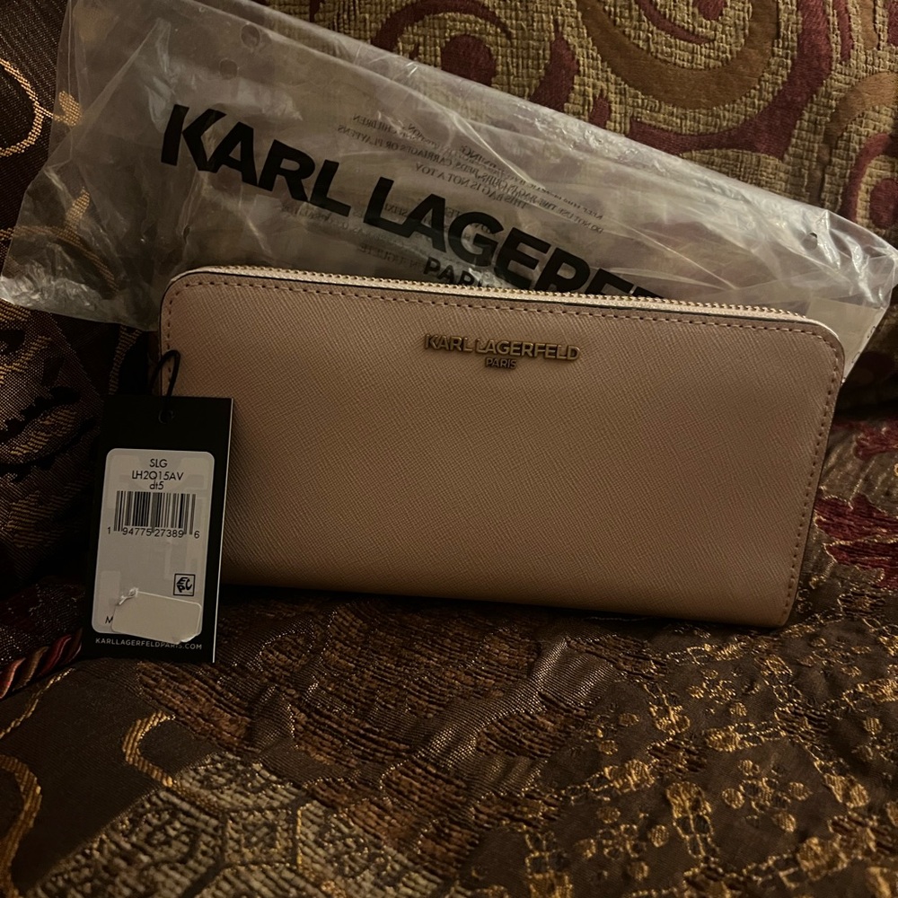 Karl Largerfeld Zip-Around Continental wallet Dimensions: 8” x 4” x 1”